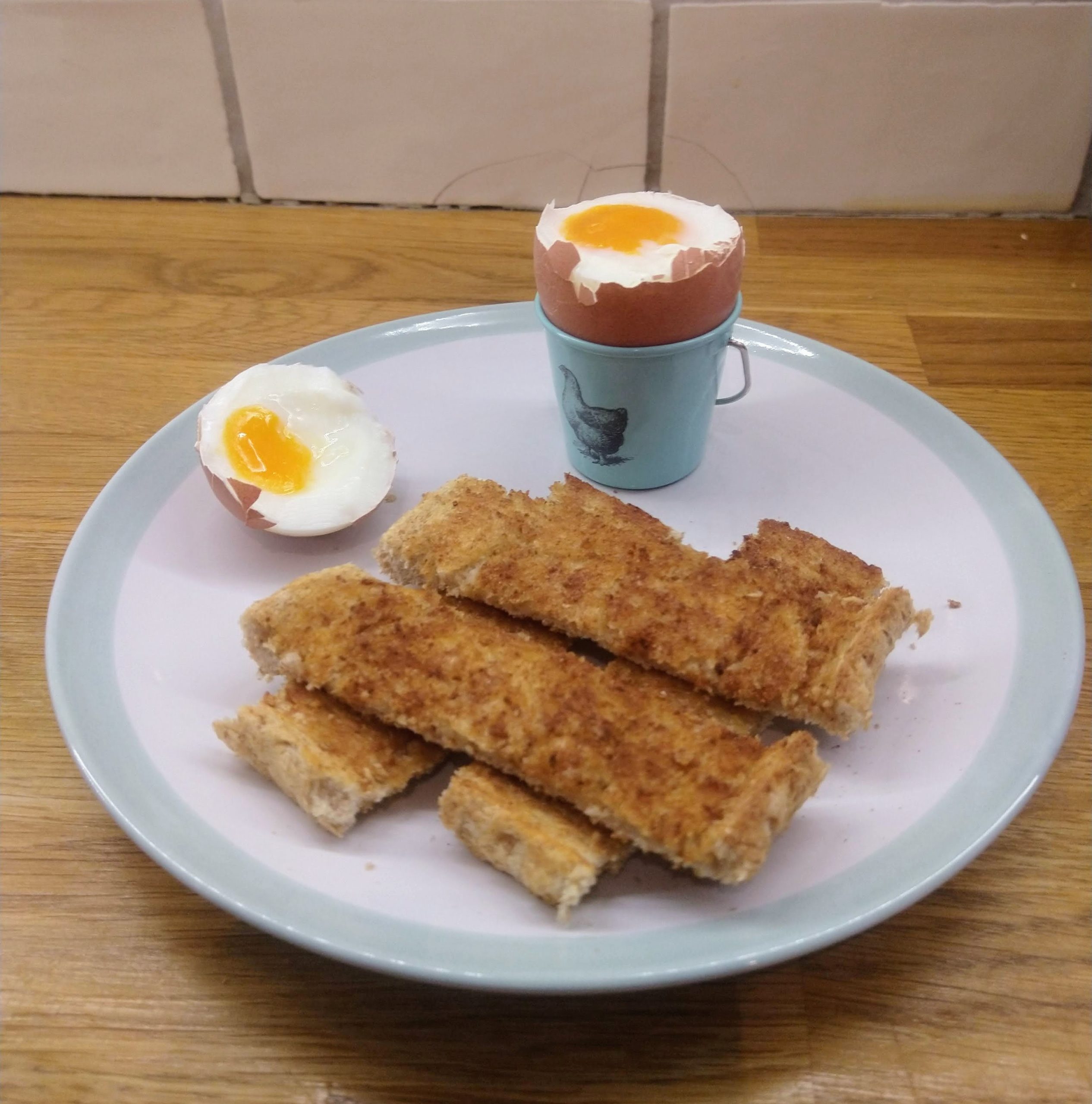 Soft boiled egg ina egg cup with toast. Cooked in a instant pot