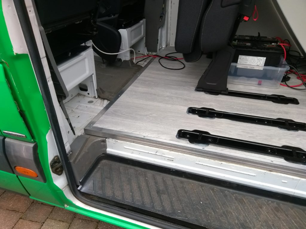 A picture of the floor with a spare bracket set in for the third seat.